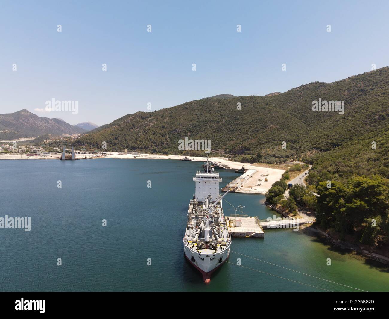 Aerial view seaven star cement - concrete carrirer cargo ship from piraeus in port of igoumenitsa city greece Stock Photo