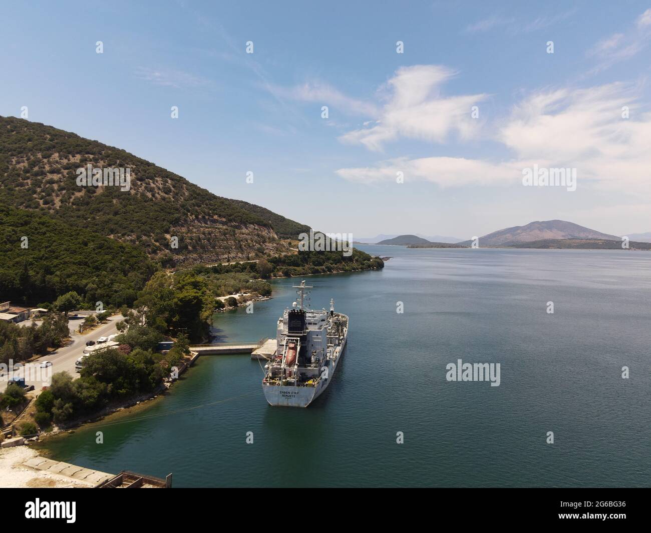 Aerial view seaven star cement, concrete carrirer industrial transport cargo ship from piraeus in port of igoumenitsa city greece with destination rio Stock Photo