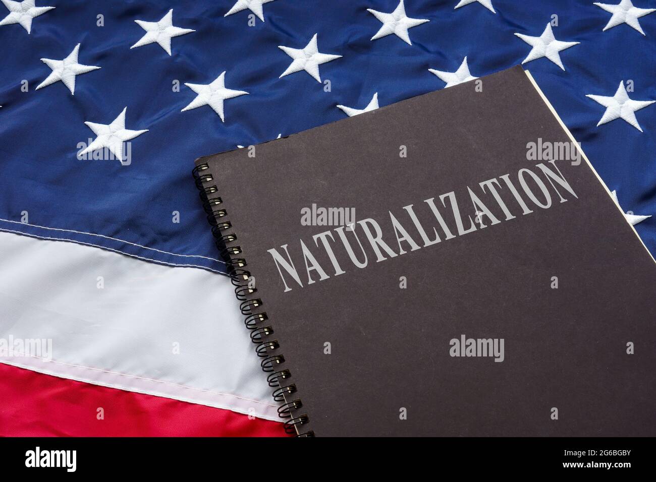 Law about naturalization on the American flag. Stock Photo