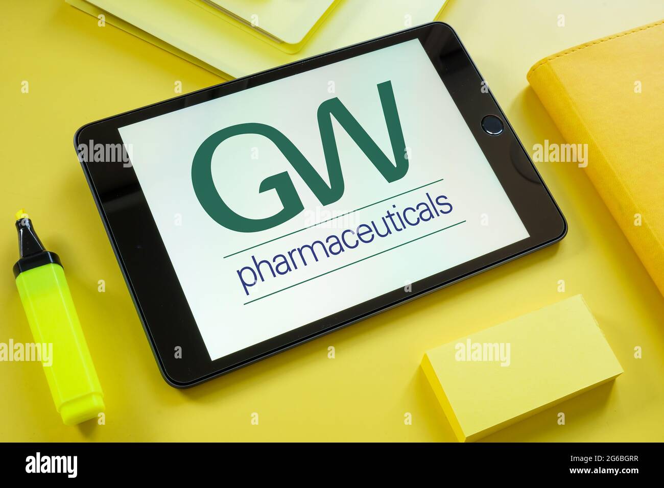 KYIV, UKRAINE - June 30, 2021. Tablet with GW pharmaceuticals logo on the screen. Stock Photo