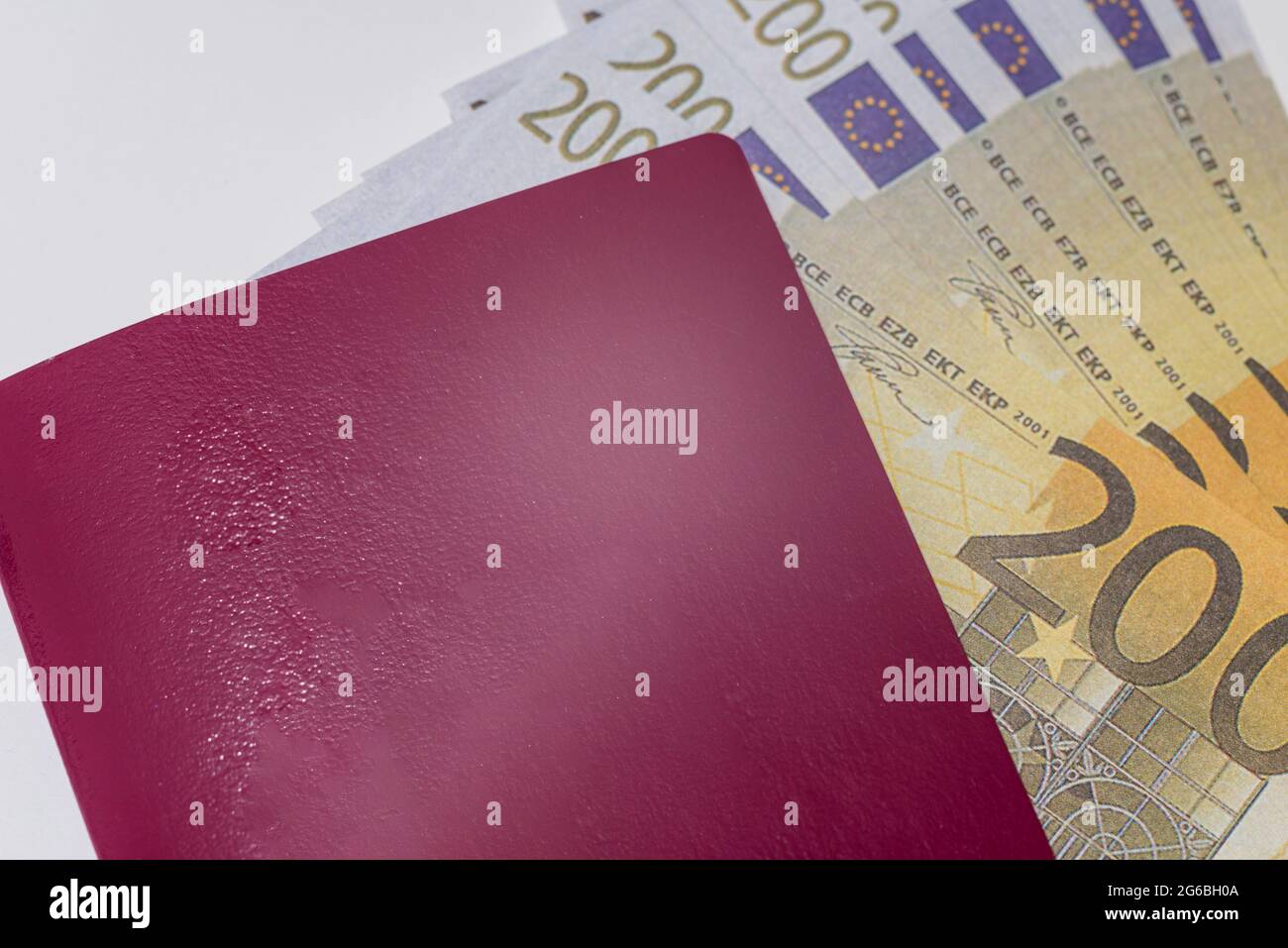Red Biometric passport is on paper euro bills. Concept- increase of  salaries, work in Europe, Immigration to work, visa for Europe.European  passport l Stock Photo - Alamy