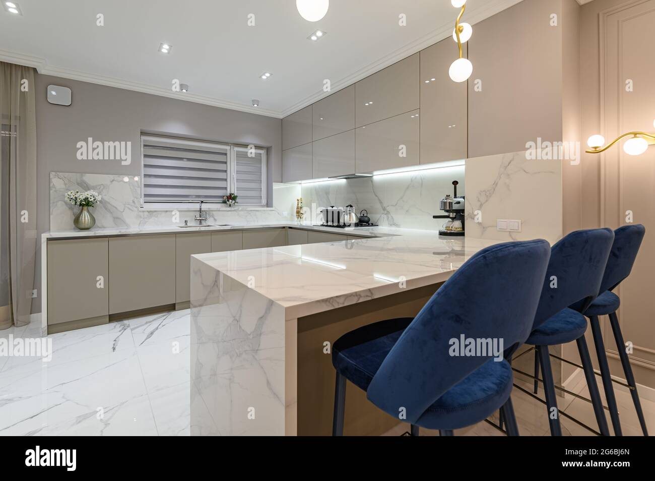 Luxury white modern marble kitchen in studio space Stock Photo Alamy