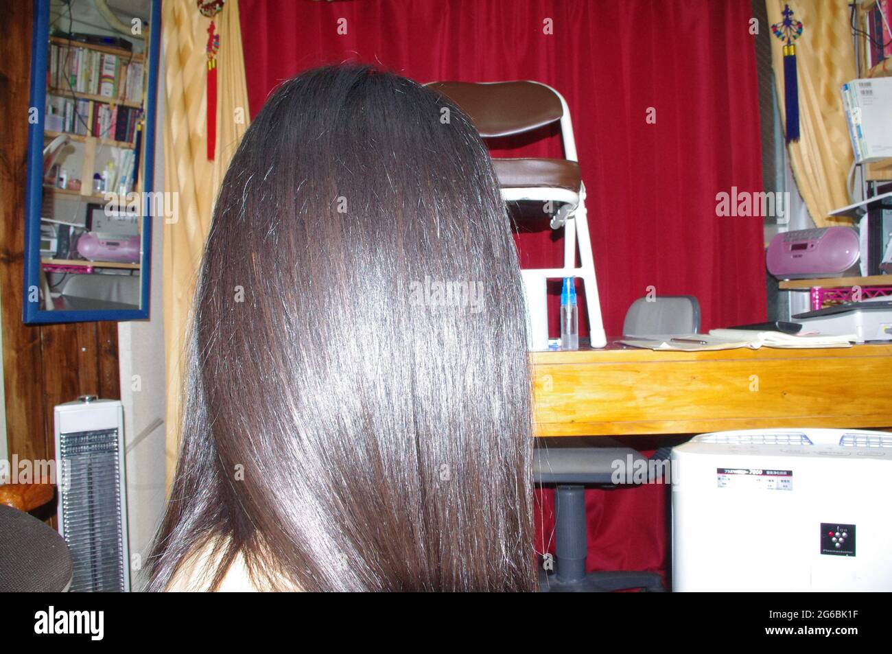 Permanent Hair Straightening Stock Photo
