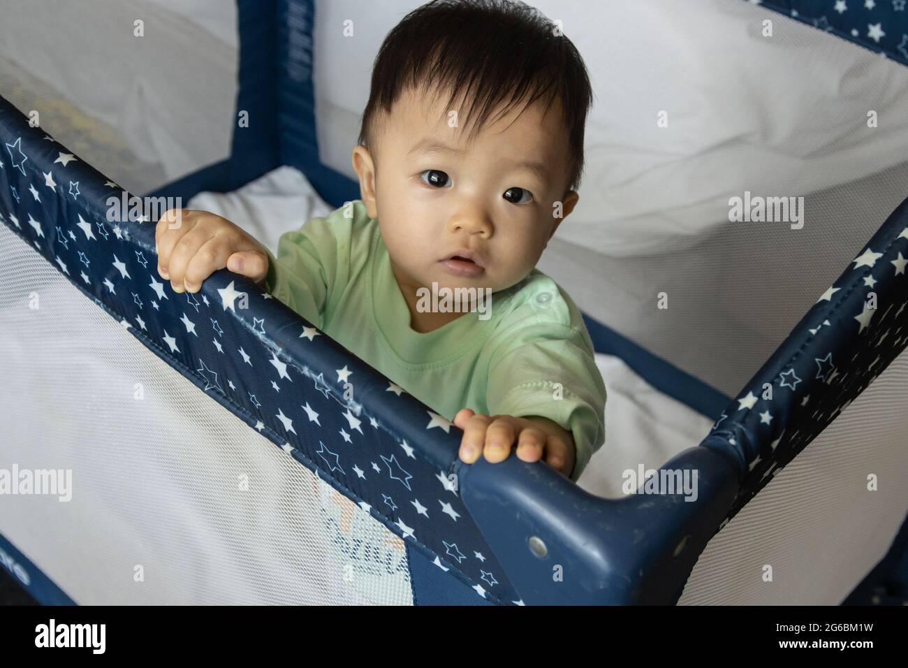 Portrait image of happy local lifestyle Asian Chinese baby play alone