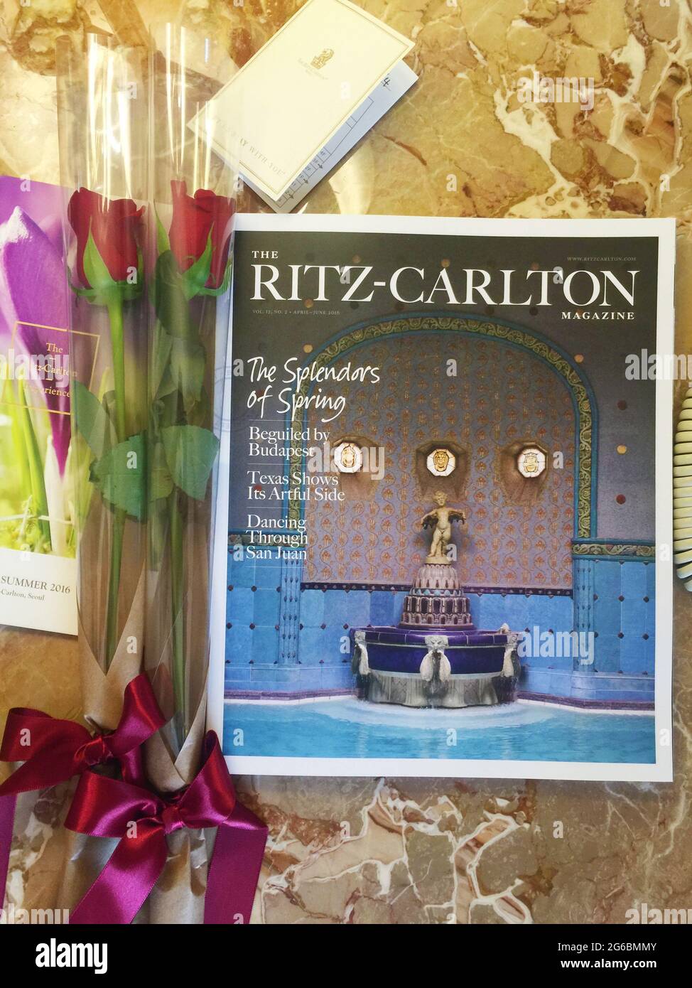 Seoul, South Korea - April 23, 2016: The Ritz Carlton Hotel Magazine and roses given at check in. Stock Photo