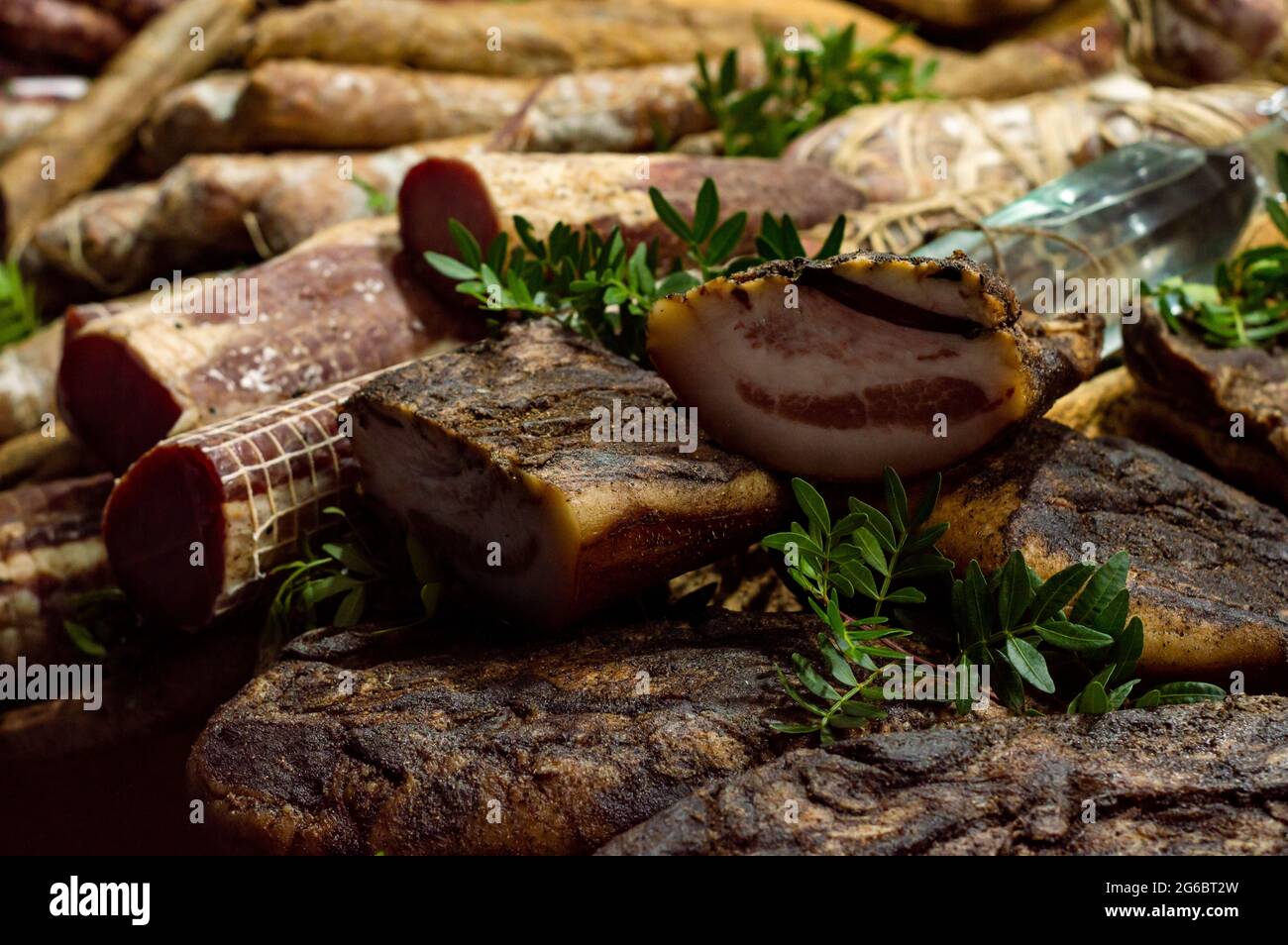 Italian salami and bacon, cured meat with laurel herbs, traditional