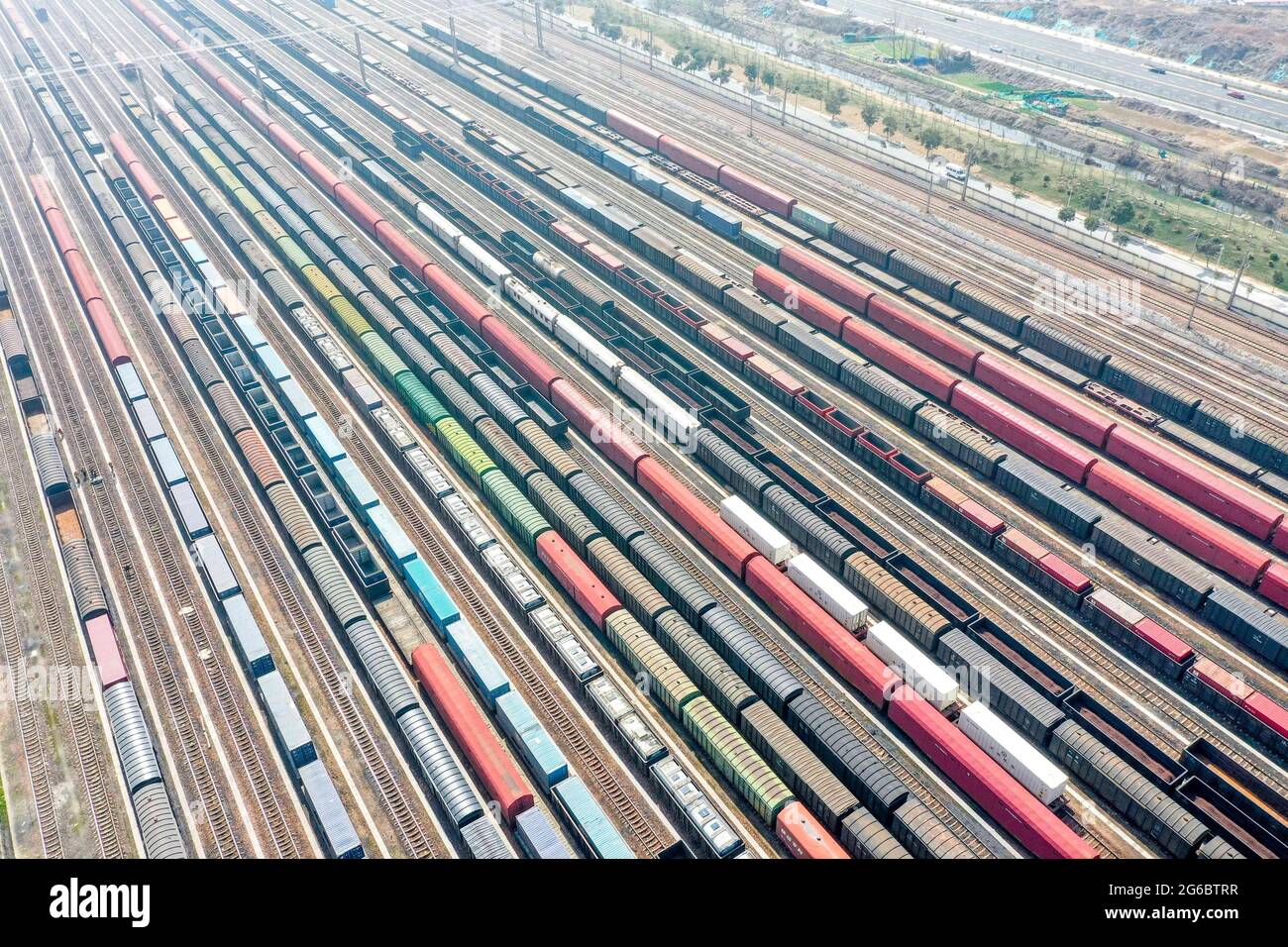 July 5, 2021, Zhengzhou, Zhengzhou, China: On July 3, 2021, Zhengzhou City, Henan Province, aerial photographs of freight cars at the railway marshalling station of Zhengzhou North Railway Station.....Zhengzhou North Railway Station is a special-class station under the jurisdiction of China Railway Zhengzhou Bureau Group Co., Ltd., and an important station connecting Beijing-Guangzhou Railway and Longhai Railway. Construction started in 1959 and completed and put into use in 1963. It mainly handles the arrival, disassembly, marshalling, and departure tasks of freight trains on the Beijing-Guan Stock Photo