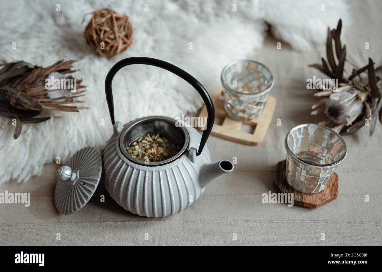 Close-up of a teapot in a Scandinavian style with tea. Stock Photo