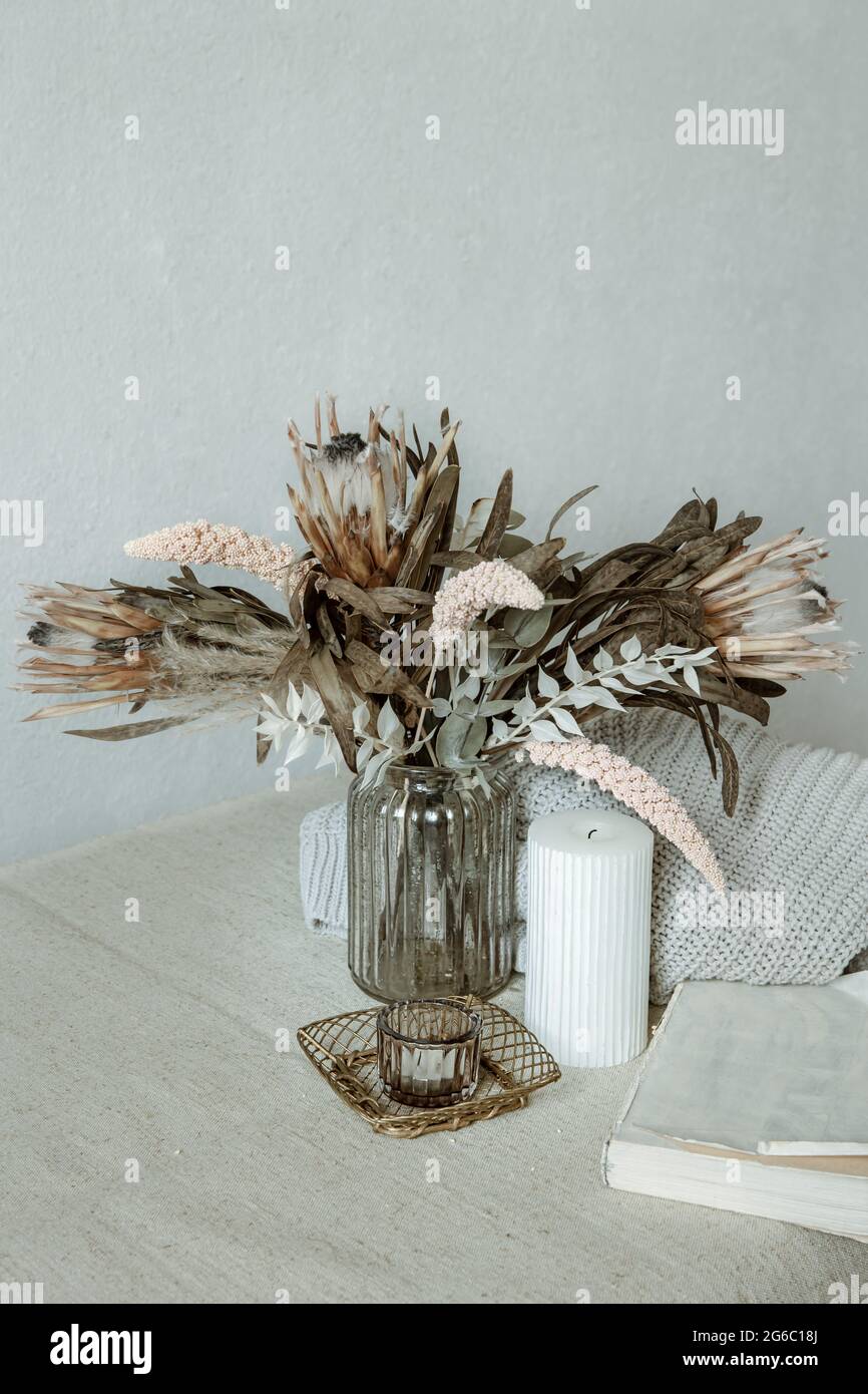 Still Life In The Scandinavian Style With A Bouquet Of Flowers A Knitted Element And Decorative Details Stock Photo Alamy