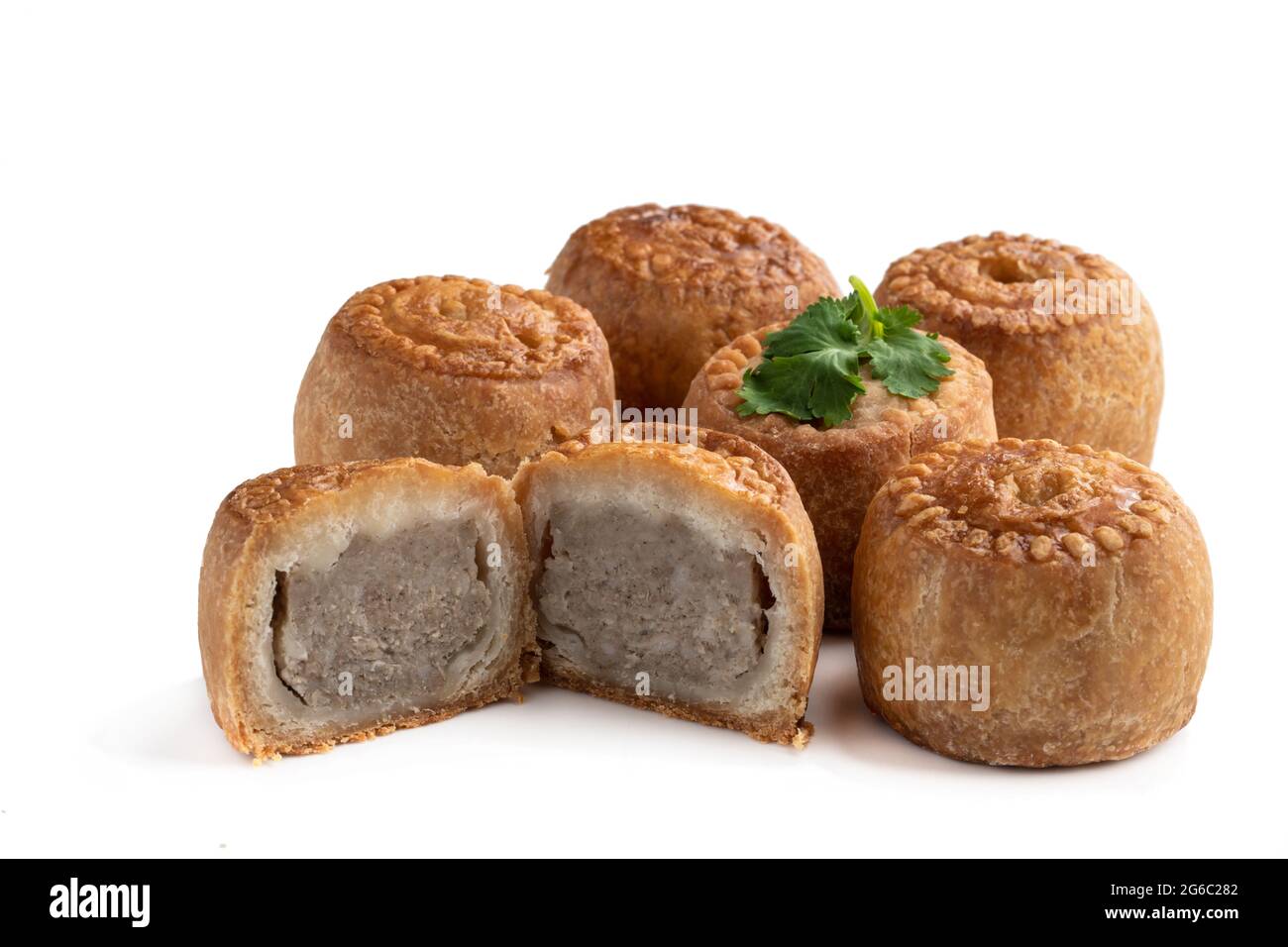 Mini Melton Mowbray pork pies with one halved isolated on white background  Stock Photo - Alamy