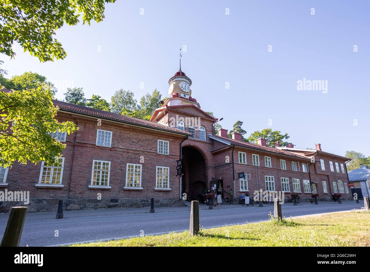 The clock tower building in Fiskars village, a historical ironworks area and popular travel destination. Stock Photo