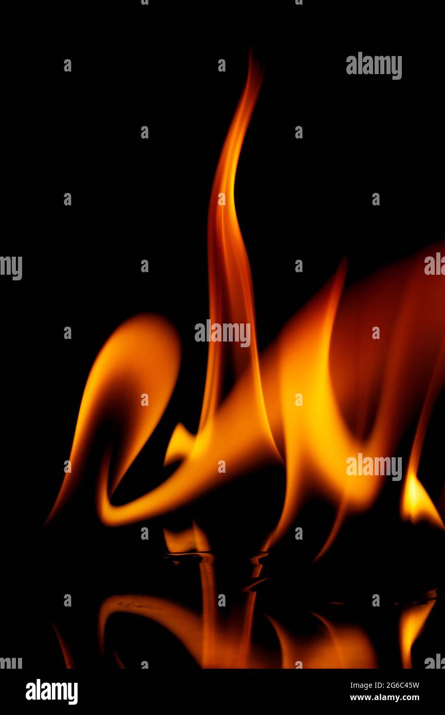 Fire flames isolated on a black background Stock Photo - Alamy