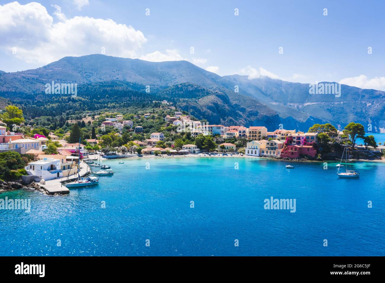 Blue bay of Assos village of Cefalonia island, Greece. Aerial panoramic drone photo travel summer vocation concept Stock Photo