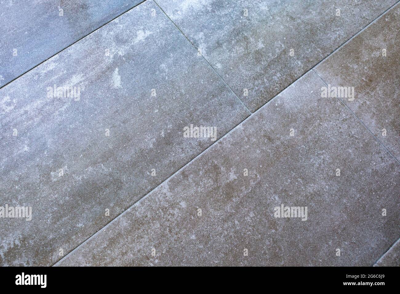 Grey stone texture pattern - patchwork tile / tiled background Stock Photo