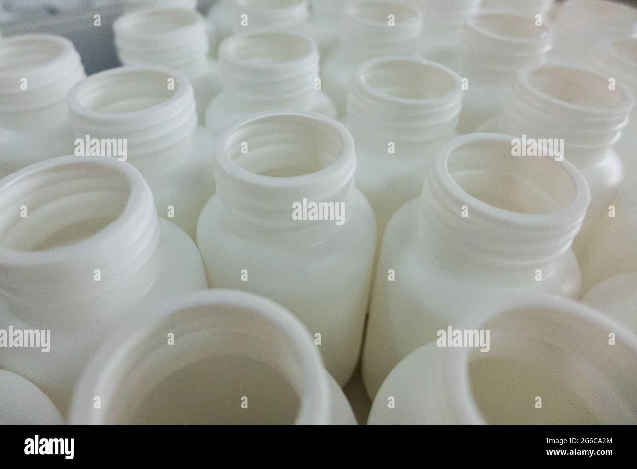 Empty white medical plastic bottles for production Stock Photo
