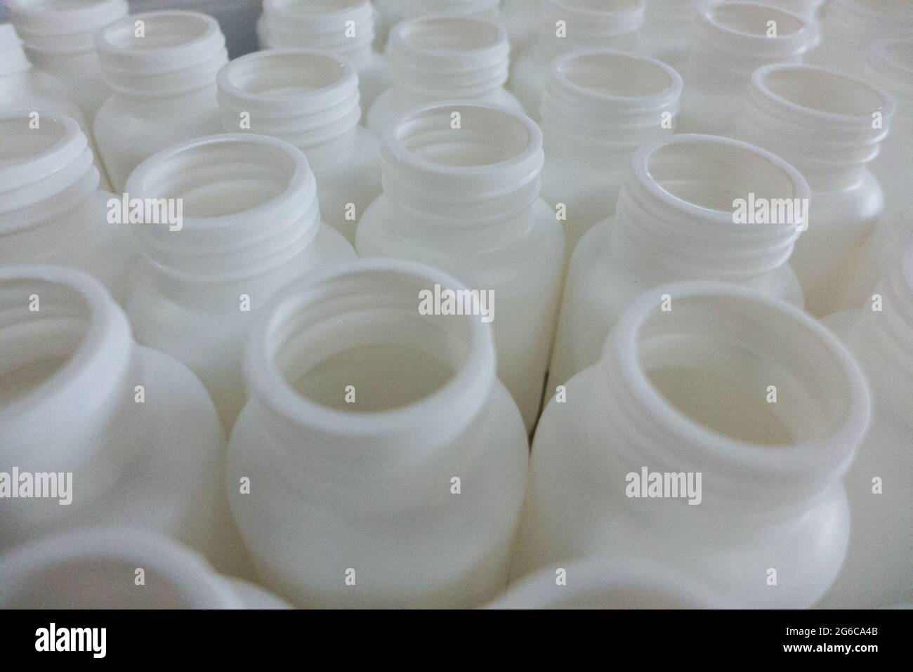 Empty white medical plastic bottles for production Stock Photo