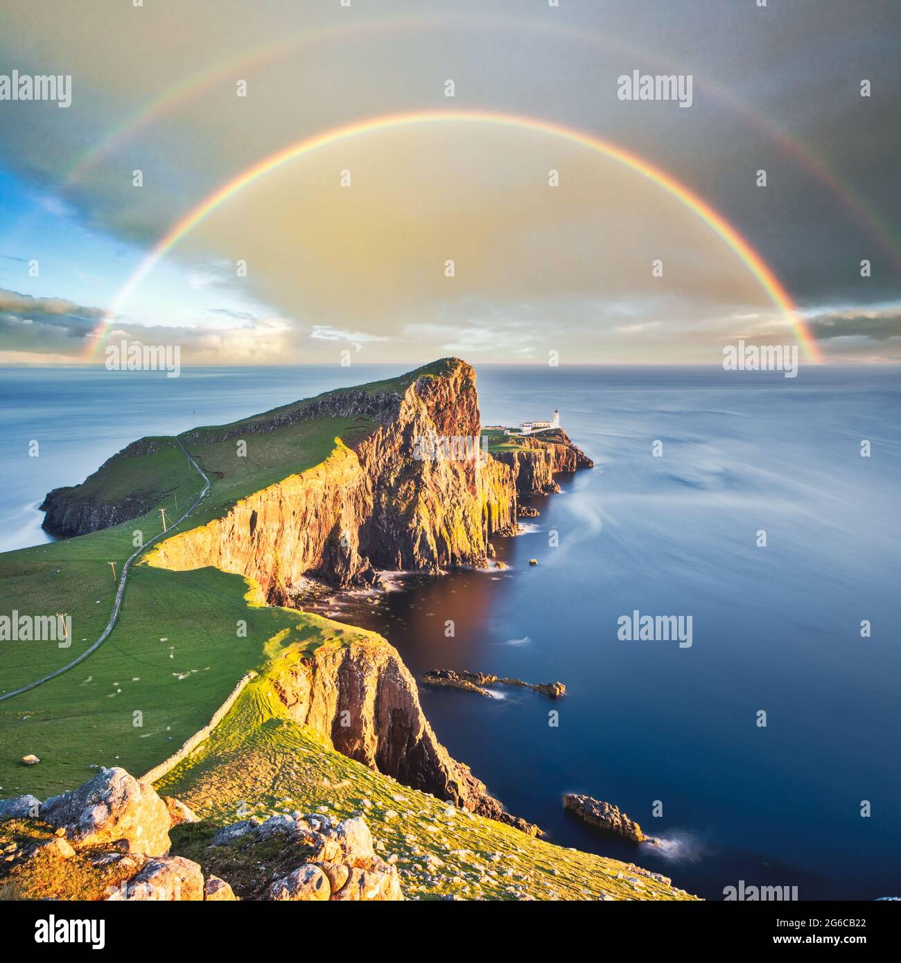 Wonderful sunset with rainbow at the Neist point lighthouse in Scotland Stock Photo