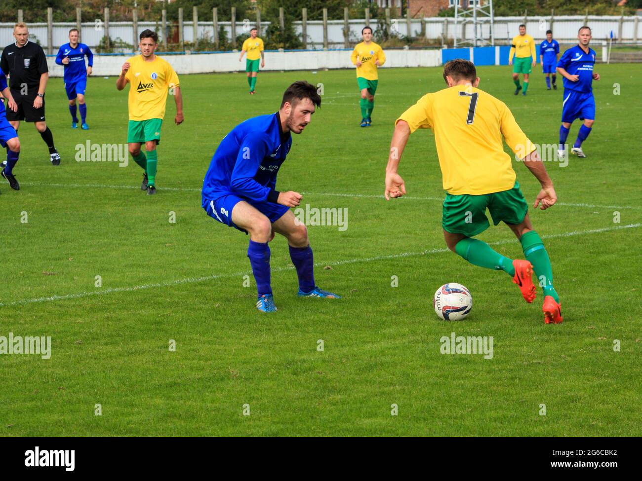 Local football match between Billingham and Stockton in north east England,UK. Winger trying to dribble past full back Stock Photo