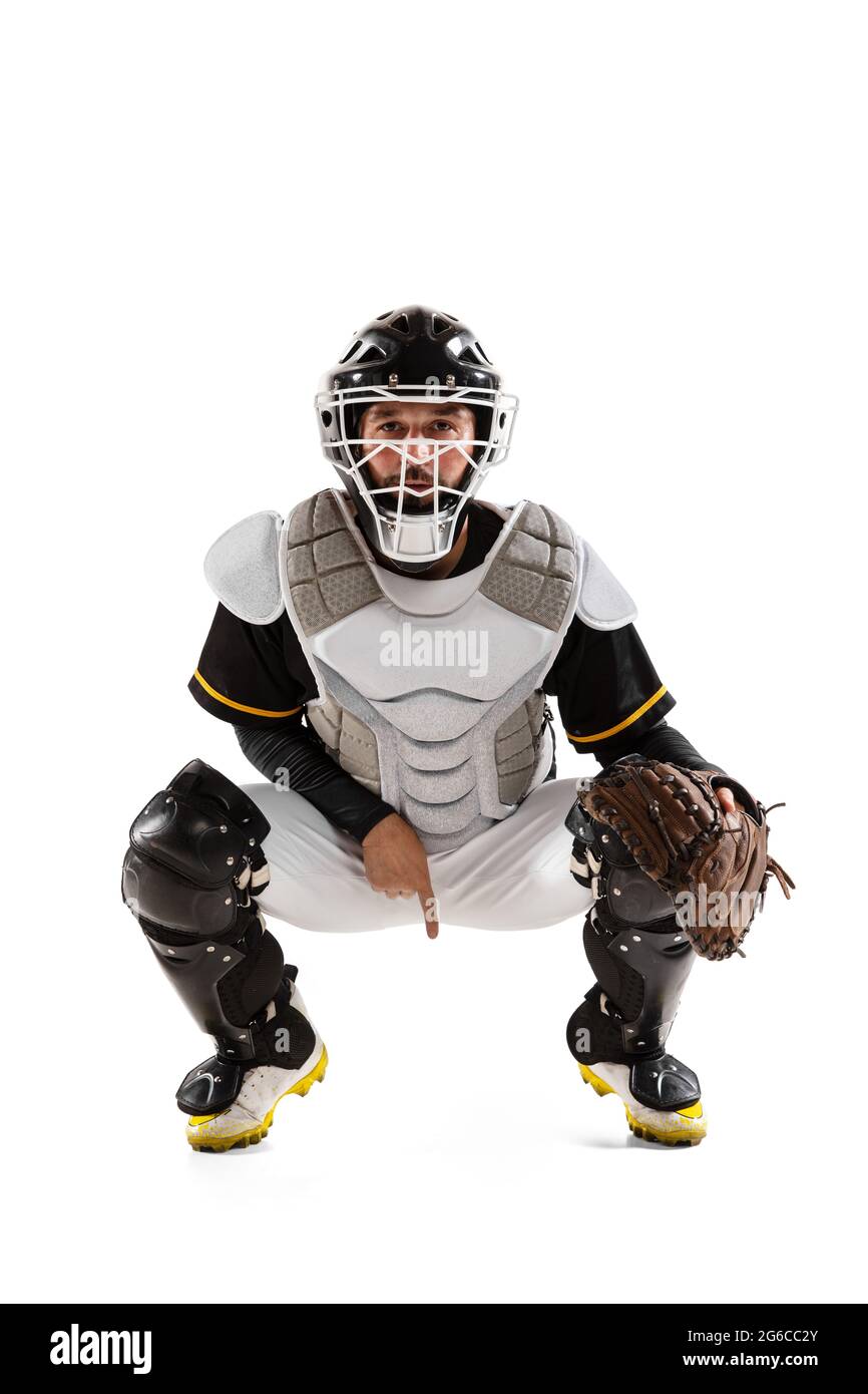Baseball player, catcher in white sports uniform and equipment practicing isolated on a white studio background. Stock Photo