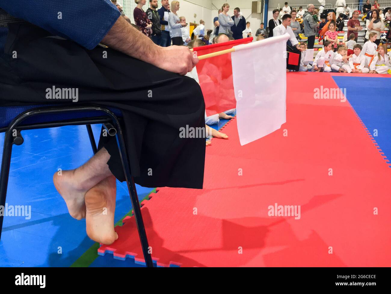Judge with red and white flags at a karate sports competition Stock