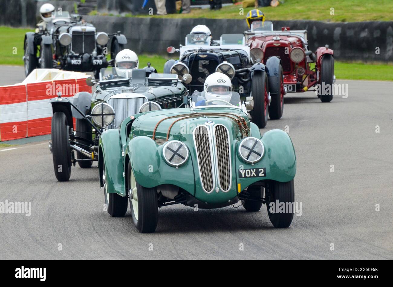 BMW 328 classic, vintage racing car competing in the Brooklands Trophy at the Goodwood Revival historic event, UK. Driven by David Cottingham Stock Photo
