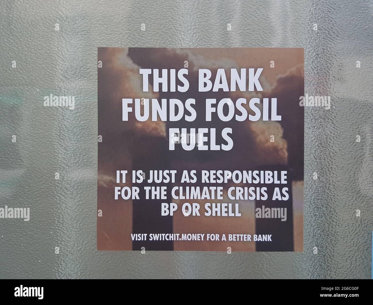 Woodbridge, Suffolk, UK July 05 2021: Extinction rebellion poster that has been put up on the walls of a Barclays bank claiming they fund climate cris Stock Photo
