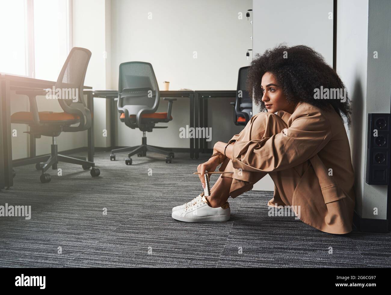 Calm employee resting on the office floor Stock Photo Alamy