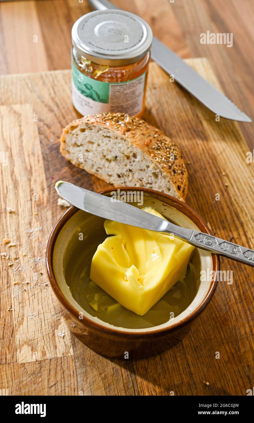 Granary bread with real butter Stock Photo Alamy