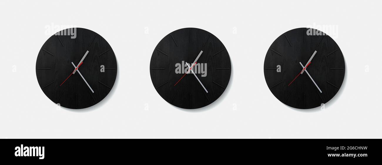 Stylish black round clock on a white wall. Time on the wall as an