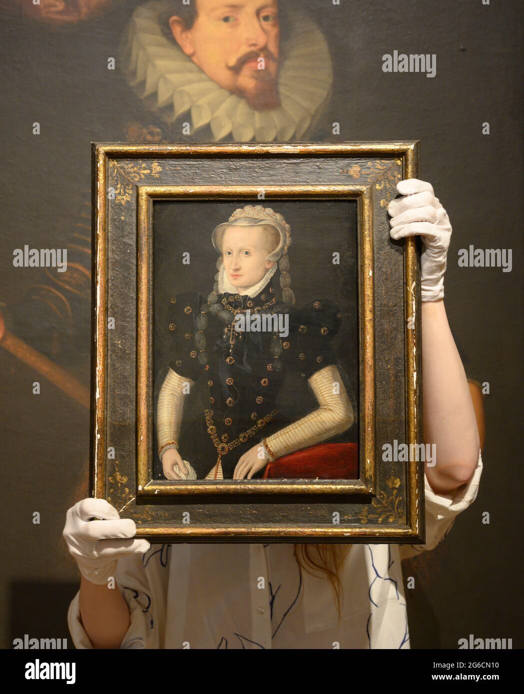 Bonhams, London, UK. 5 July 2021. The Classics Week at Bonhams includes the Old Master paintings sale on 7 July. Image: Circle of Frans Pourbus the Elder, (Bruges 1545-1581 Antwerp). Portrait of a lady, half-length, in black costume and a white braided headdress, estimate: £6,000-8,000; (Background): Studio of Frans Pourbus the Younger (undefined, Antwerp 1569-1622 Paris). Portrait of Vincenzo I Gonzaga, Duke of Mantua, in armour and wearing the Order of the Blood of Jesus Christ, estimate: £15,000-20,000 Credit: Malcolm Park/Alamy Live News Stock Photo