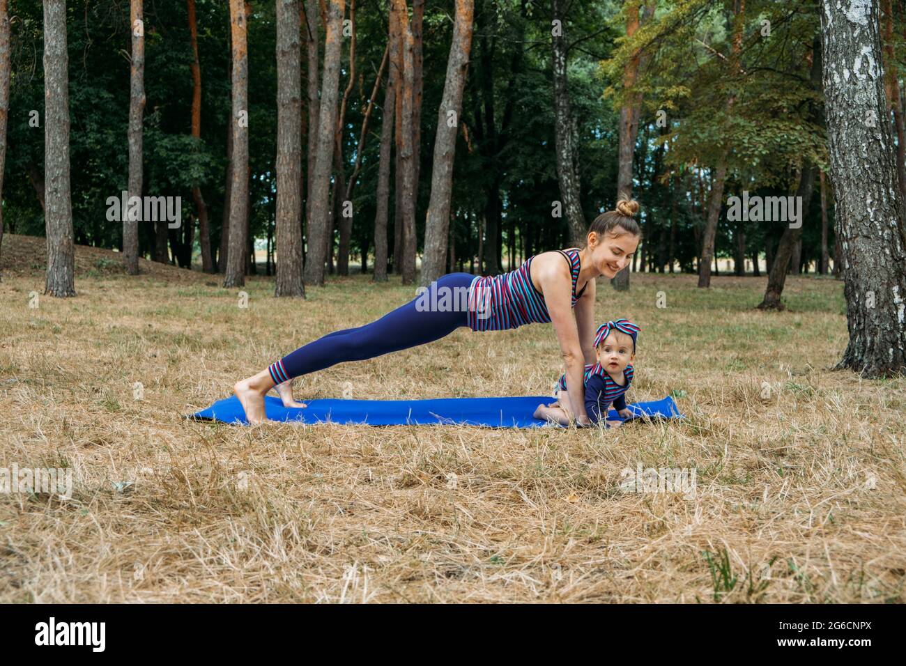 Mom and baby yoga outdoor classes. Wellness, family yoga class