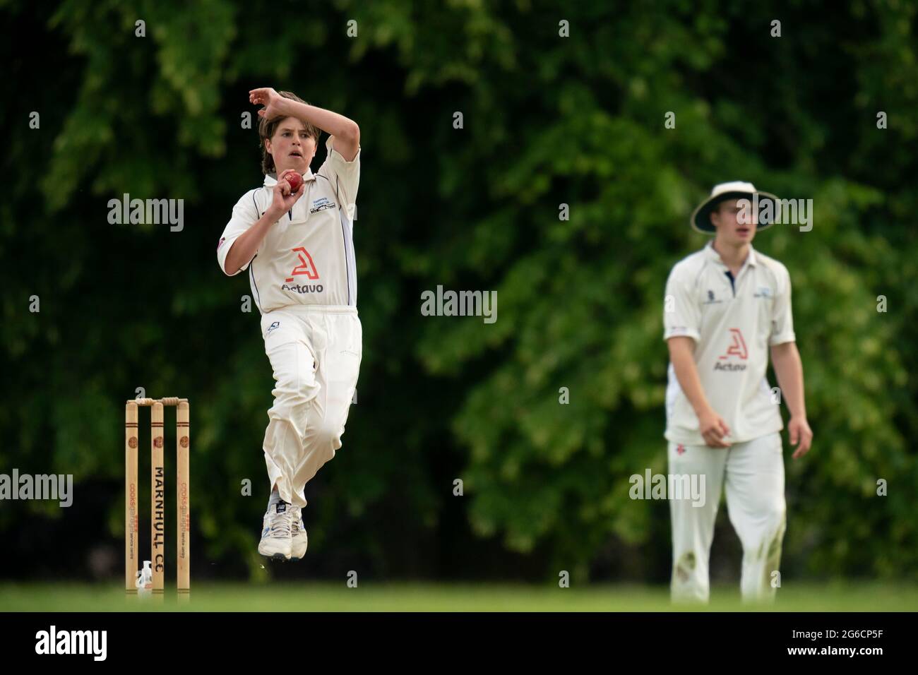 Young cricket bowler in action. Stock Photo