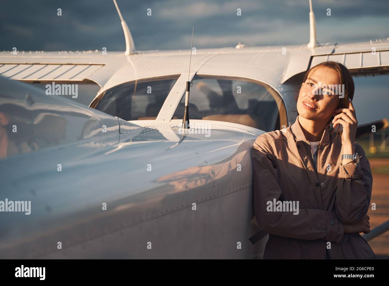 Attractive young female airline pilot hi-res stock photography and ...