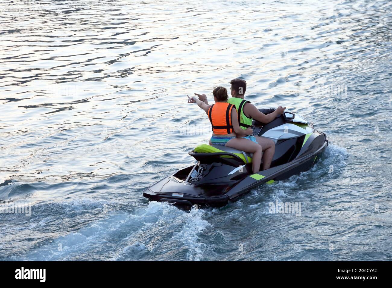 Man Water Rider man and woman ride on a water scooter Stock Photo - Alamy