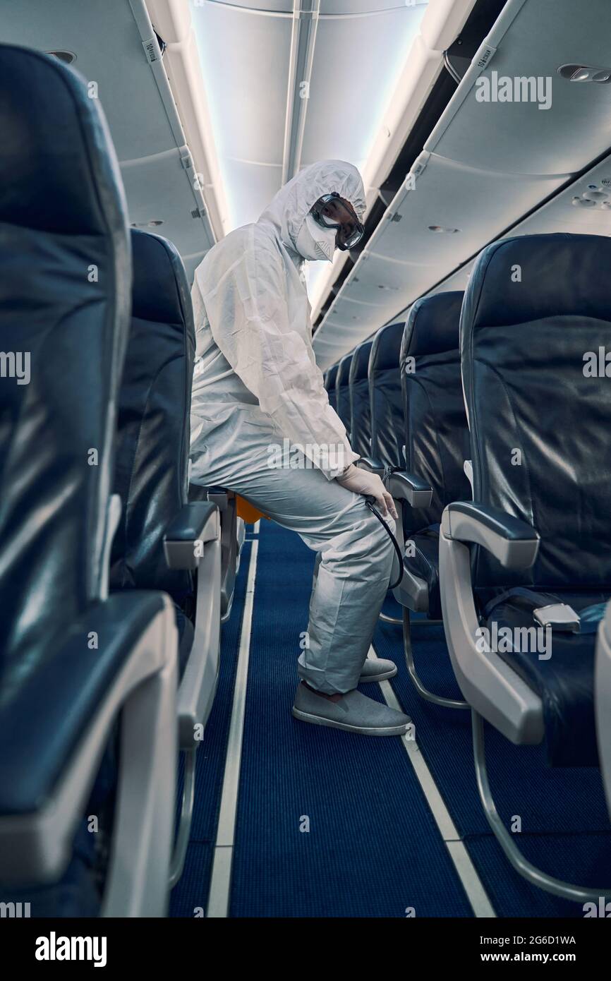 Worker posing for the camera after the antiviral cabin disinfection Stock Photo