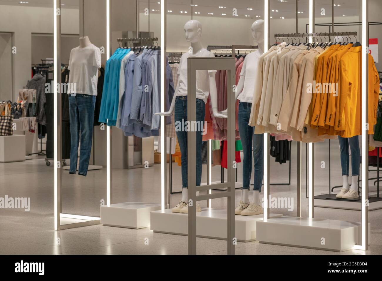Modern fashionable brand interior of clothing store inside shopping ...
