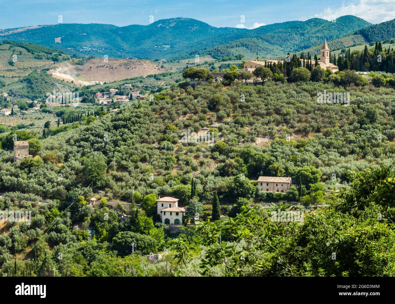 View north from Trevi overlooking the hillside with  the Convento San Martino siting on top. The Apennines in the distance, June 2021 Stock Photo