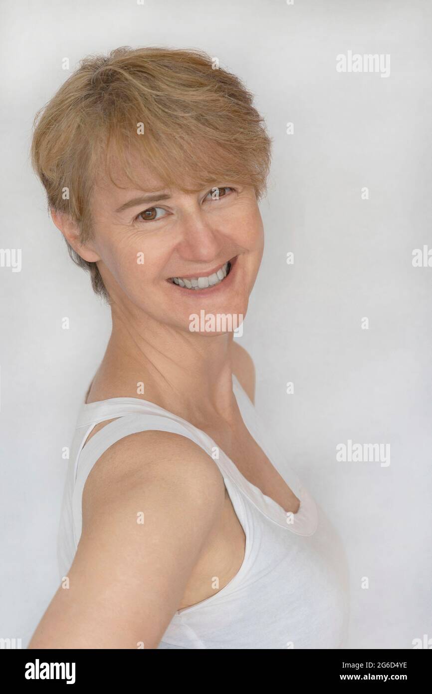 Portrait of a smiling 50 year old woman Stock Photo Alamy