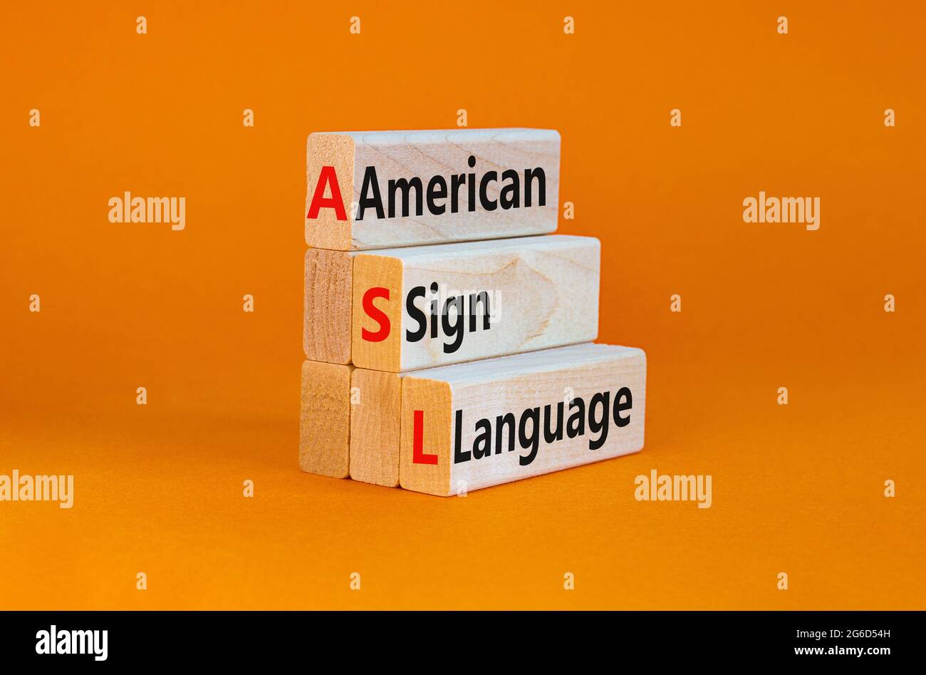 ASL, american sign language symbol. Wooden blocks with words 'ASL