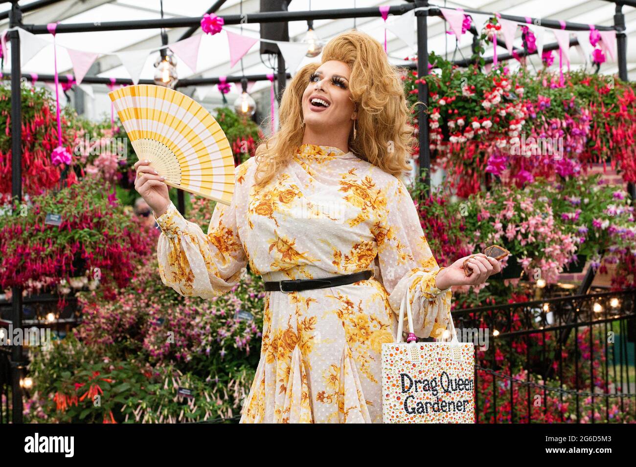 London, UK. 5th July, 2021. Drag Queen Daisy Desire, The Drag Queen Gardener. Press preview of the RHS Hampton Court Palace Garden Festival which runs from July 6th-July 11th. Credit: Mark Thomas/Alamy Live News Stock Photo