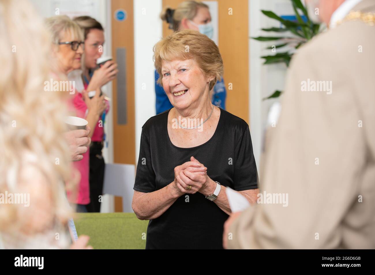 Margaret Keenan enjoys a NHS Big Thank You tea at UHCW, Coventry, where she received the worlds first non-clinical trail dose of Covid-19 vaccine. Stock Photo