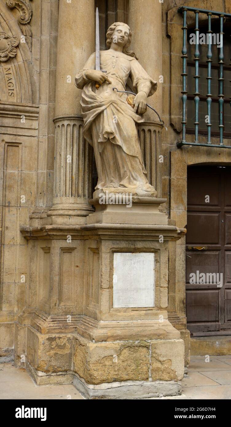 Statue at the entrance of the The Town Hall building in the historic town centre of Pamplona Navarra Spain Plaque 443.80 metres above sea level Stock Photo