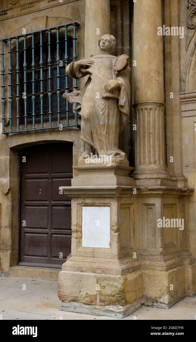Statue at the entrance of the The Town Hall building in the historic town centre of Pamplona Navarra Spain Plaque 444.57 metres above sea level Stock Photo