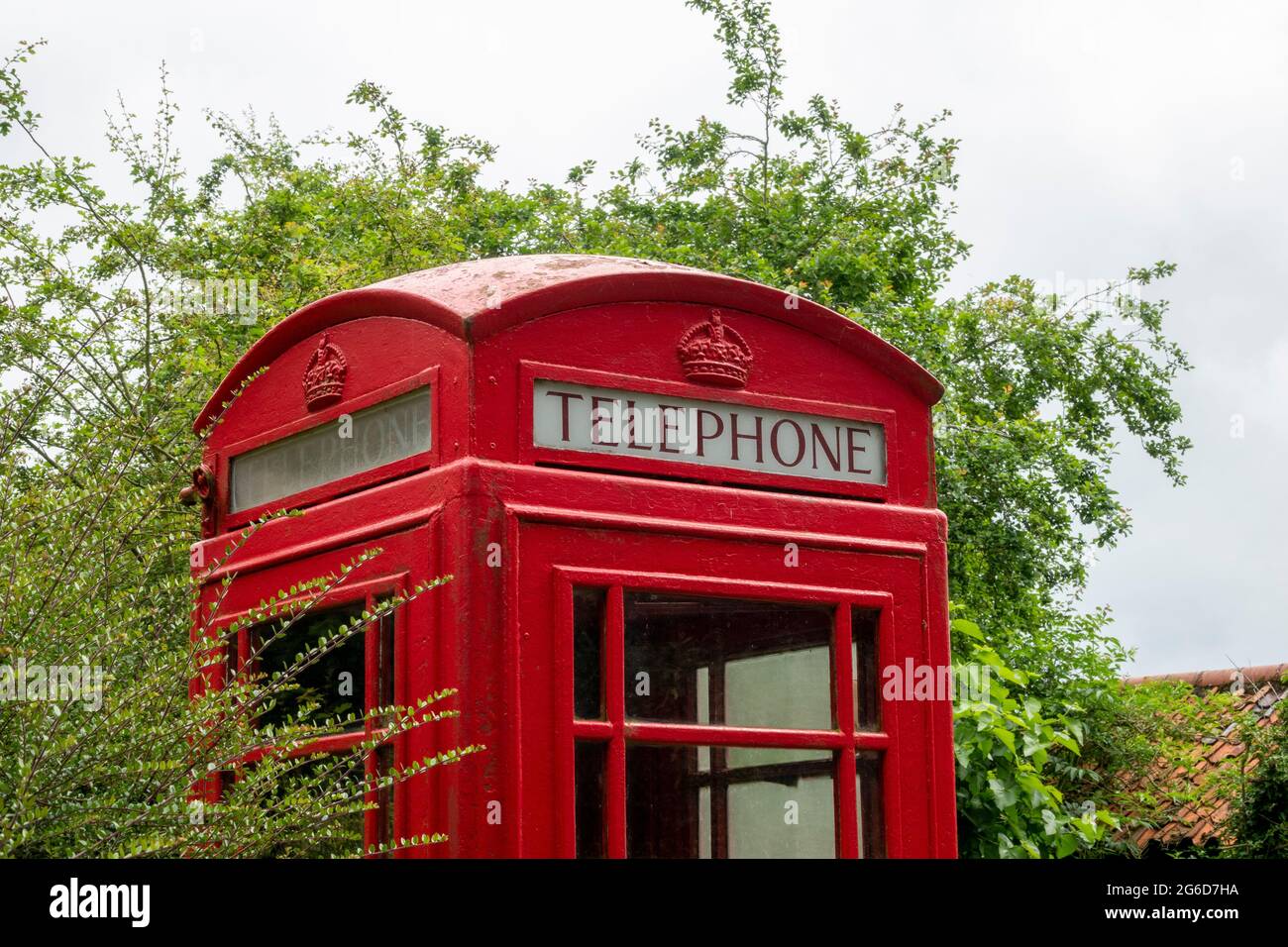 A K6 red telephone box in a rural setting Stock Photo
