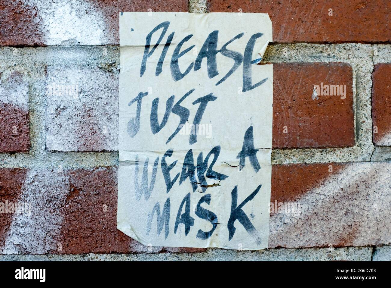 Wear a Mask graffiti, Covid Pandemic, Montreal, Canada Stock Photo