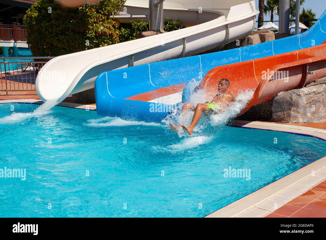 Antalya, TurkeyJune 30, 2021 Joyful little boy going down on water
