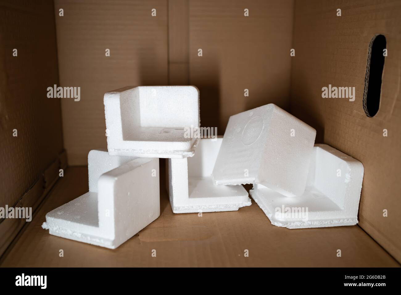 EPS foam in a cardboard box. Expanded Polystyrene foam is a product of styrene monomer. Stock Photo