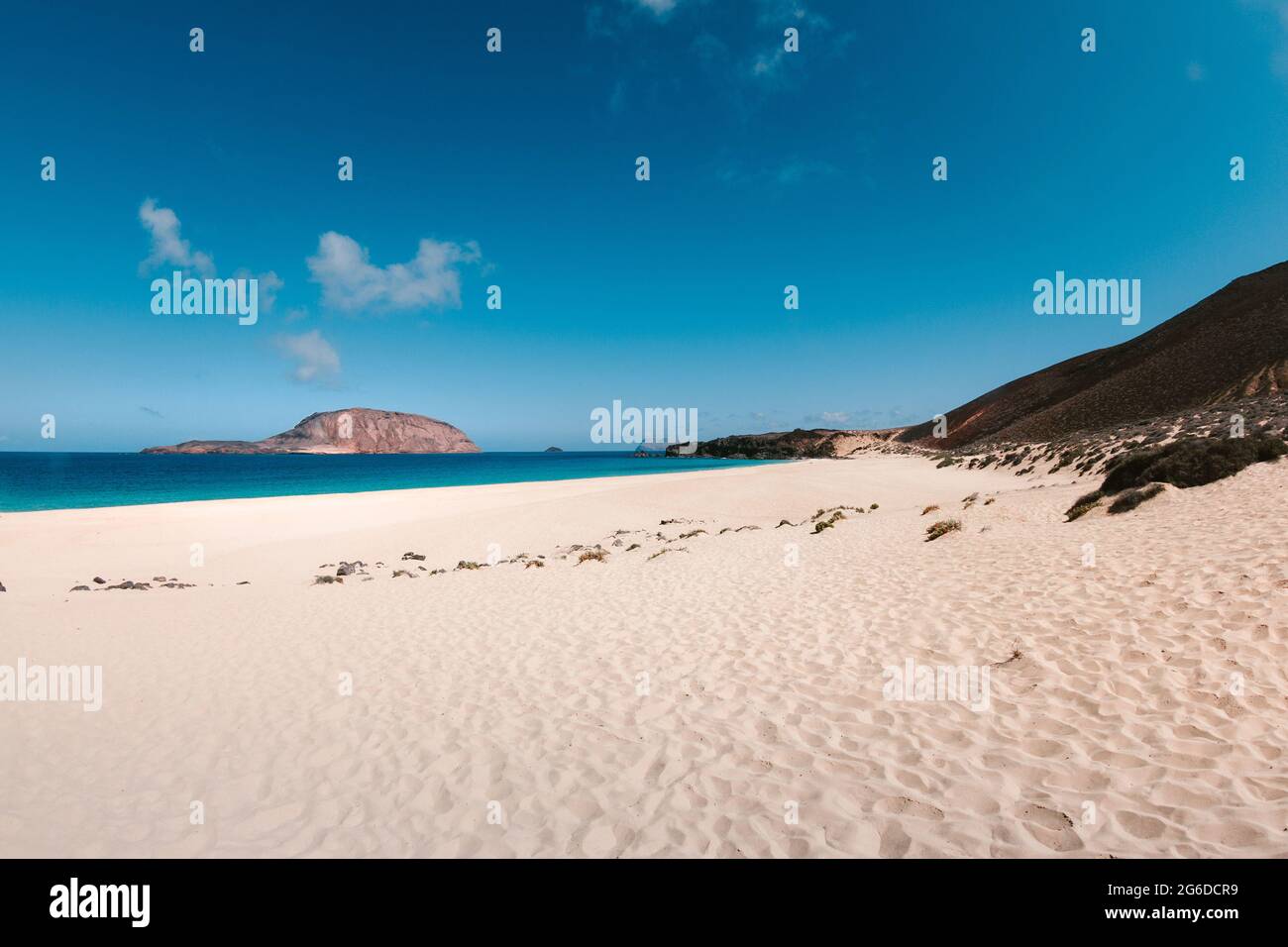 Amazing view of beach in front of sea with turquoise water under blue ...