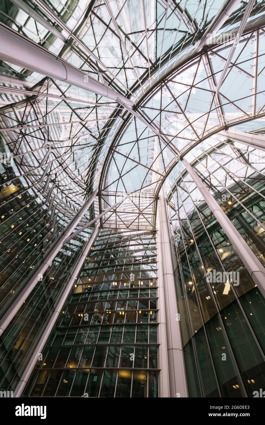 From below of cables inside of contemporary building with glass roof ...