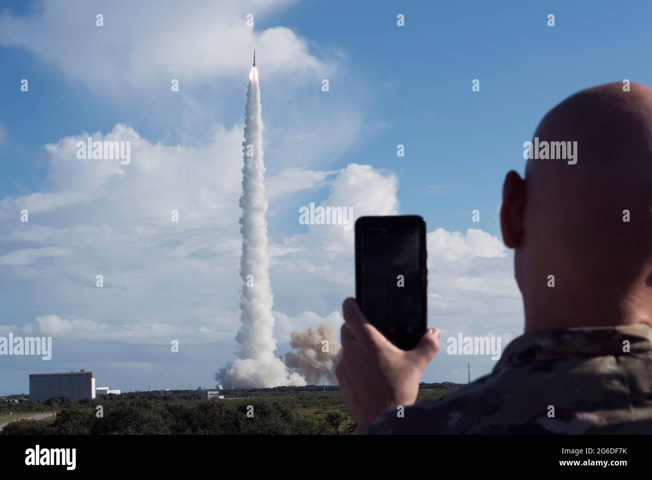 An Airman from the 45th Space Wing records the liftoff of United Launch Alliance's  Delta IV GPS III Magellan rocket on August 22, 2019, at Cape Canaveral Air Force Station. The GPS-III launched from Space Launch Complex-37 and represents the next step in modernizing the navigation network worldwide with a new generation of satellites to offer improved accuracy, better resiliency and a new signal for civil users. (U.S. Air Force photo by Airman 1st Class Zoe Thacker) Stock Photo